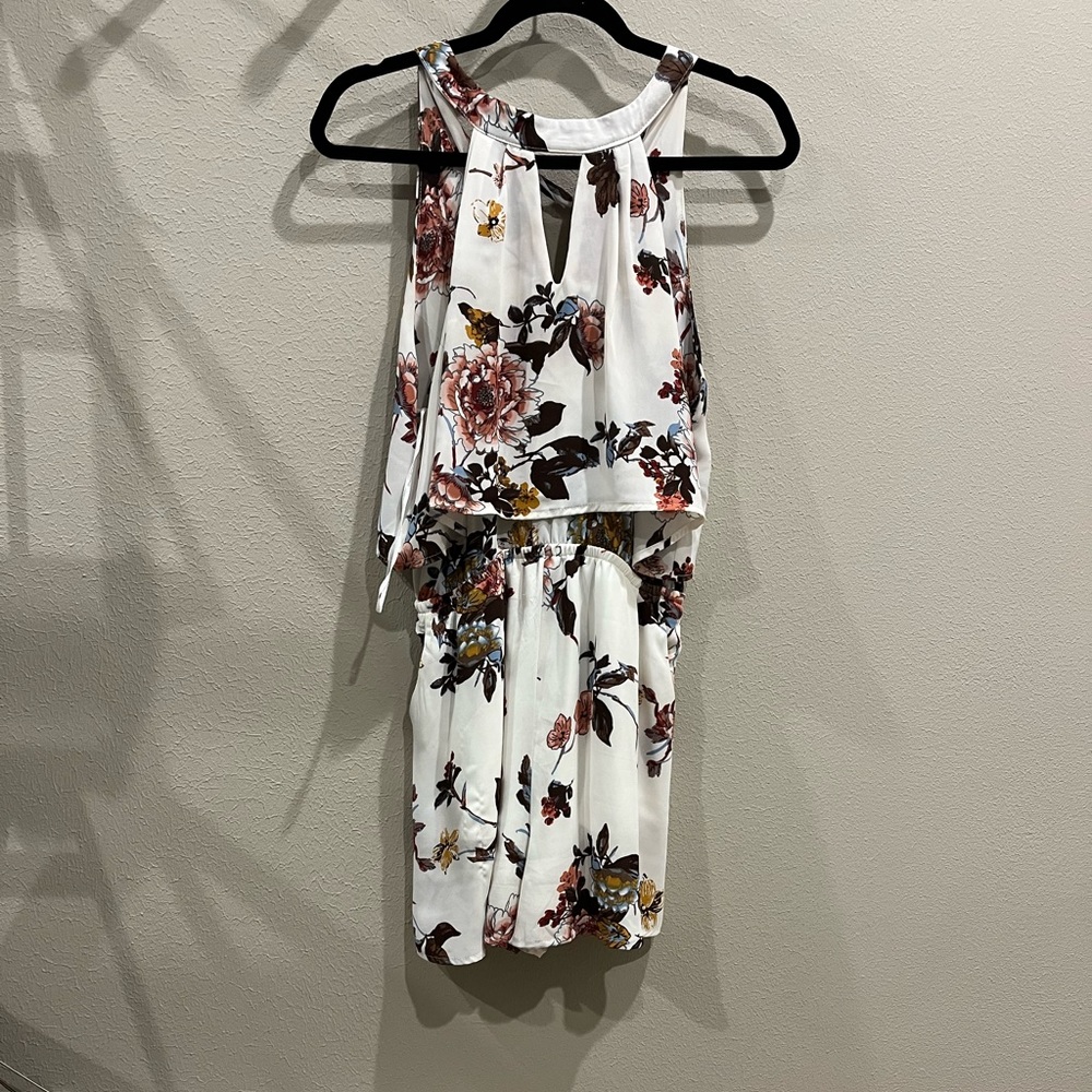 White romper with different color flowers